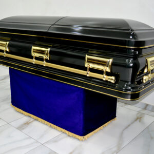 Dark green steel casket with gold linning and swing handles