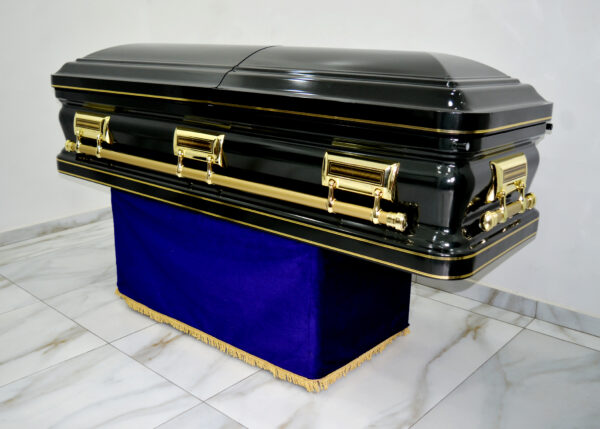 Dark green steel casket with gold linning and swing handles