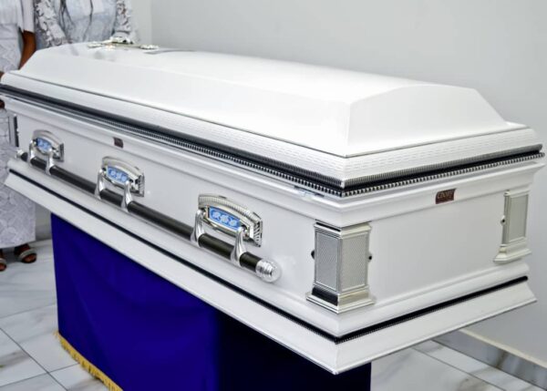 White sprayed imperial casket with silver swing accessories