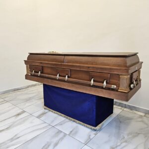 Light matt finished graduation casket with wooden stationary accessories