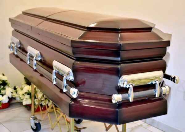 Glossy finished 8 edges casket with silver swing handles