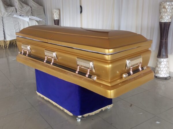 Gold sprayed modified Boska-i casket with gold swing accessories